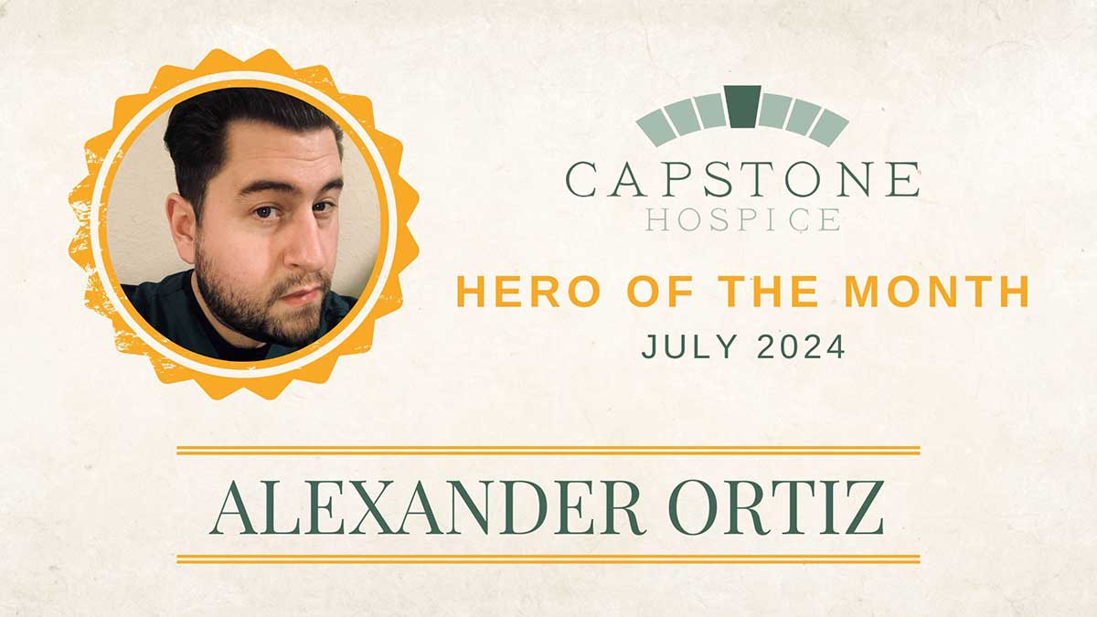 A certificate from Capstone Hospice names Alexander Ortiz as Hero of the Month for July 2024. The certificate features a portrait of a man with dark hair and a trimmed beard. The background is beige with green and orange accents.